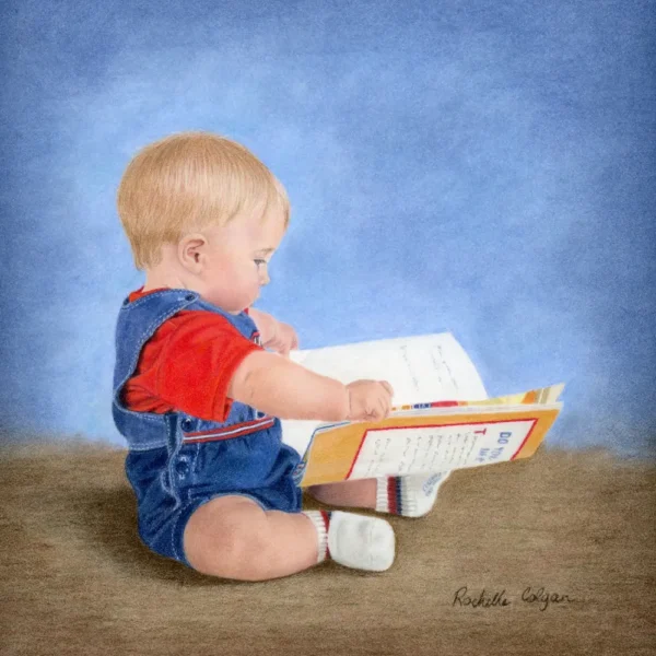 Realistic drawing of a 9 month old boy sitting on the floor looking at a story book. By Alberta artist Rochelle Colgan