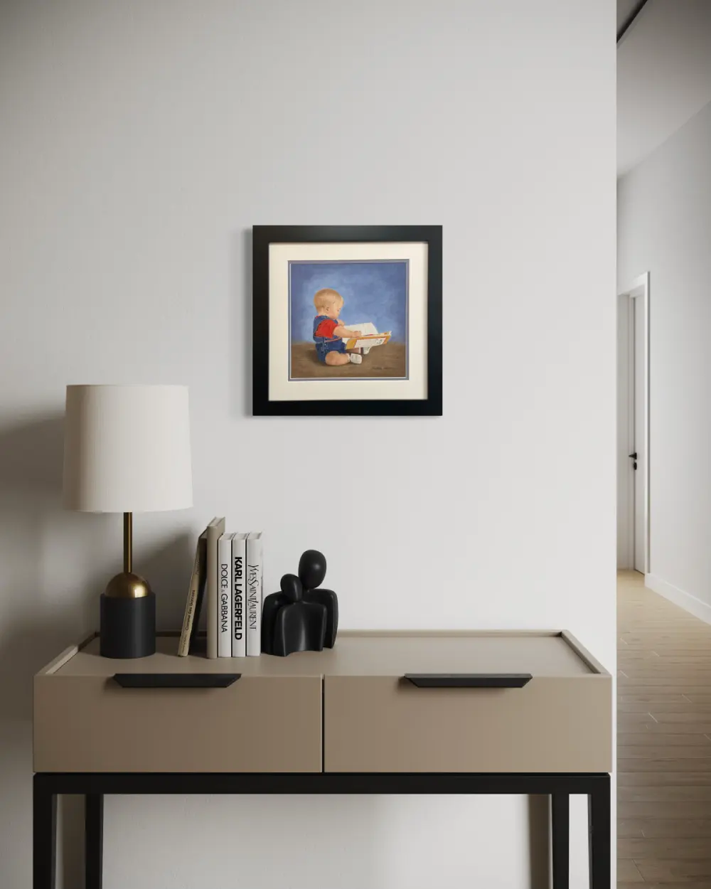 Framed realistic drawing of a 9 month old boy sitting on the floor looking at a story book, hanging on a wall. By Alberta artist Rochelle Colgan