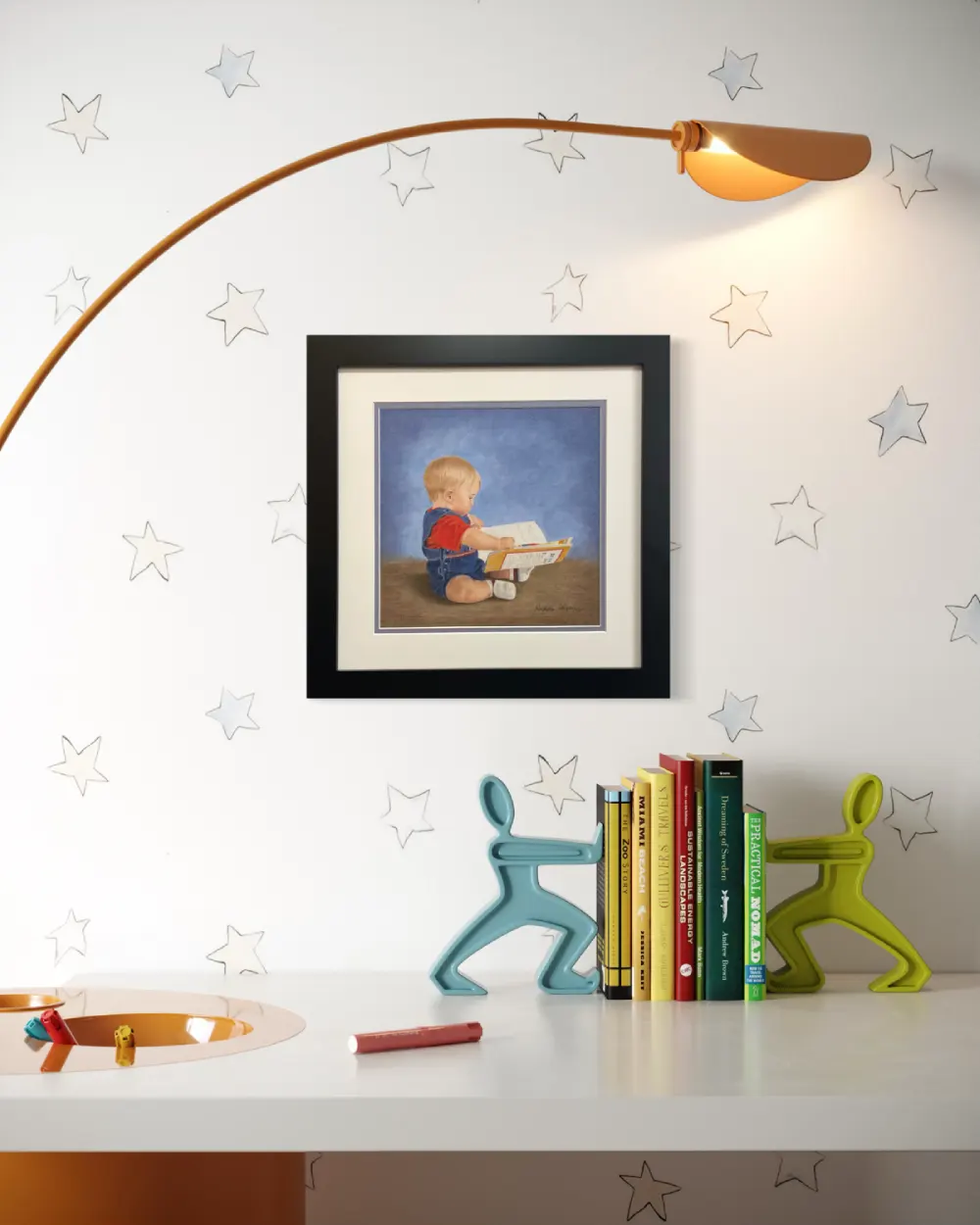 Framed realistic drawing of a 9 month old boy sitting on the floor looking at a story book, hanging on a wall. By Alberta artist Rochelle Colgan